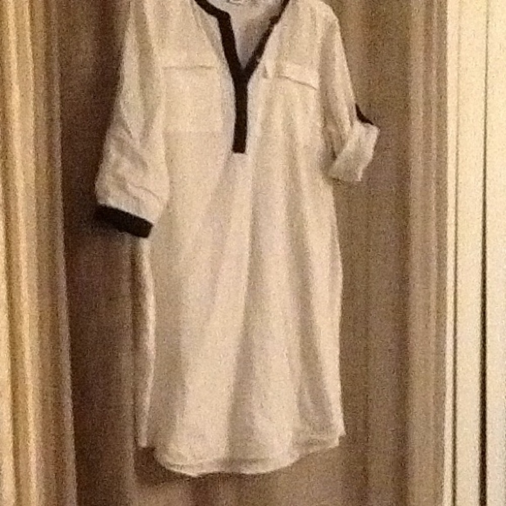 White DNKYC shirt.